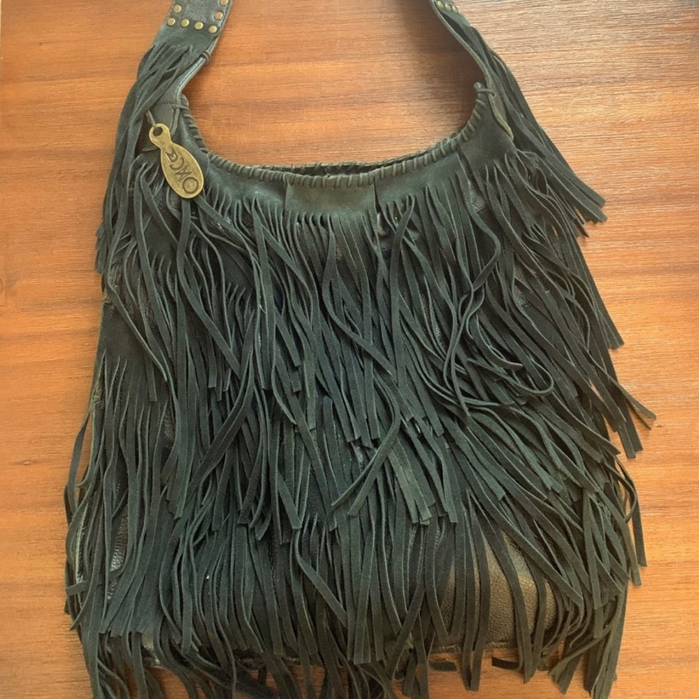 Beautiful MUXO Camila Alves black leather bag with fringe and brass hardware.